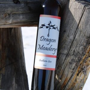 mead bottle leaning against a post